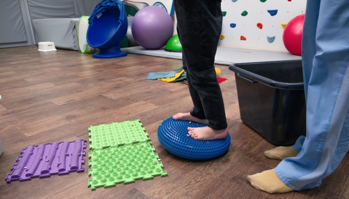 Kid on Sensory Mat Massage during sensory integration session.