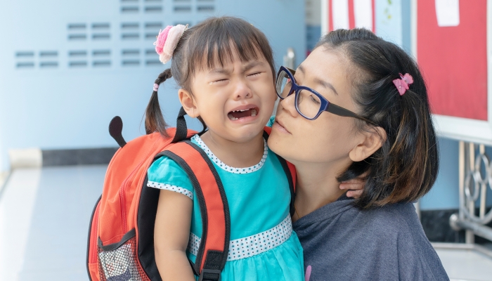 children and mother crying first day go to pre-kindergarten school.