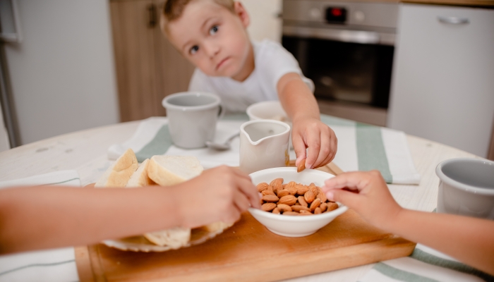 Little boy has breakfast.