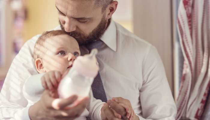 Young father with his cute little baby daughter.