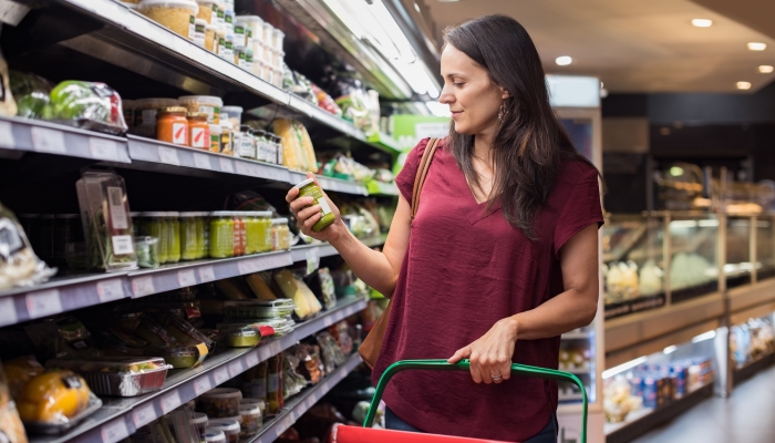 Young woman shopping in grocery store.