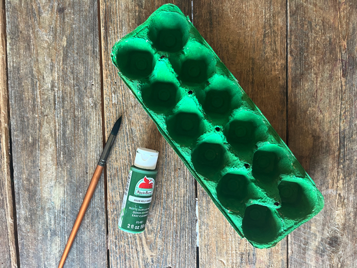 Paint the egg carton green.