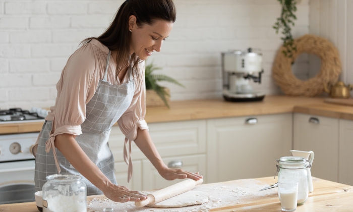 Happy attractive young adult woman lady housewife baker.