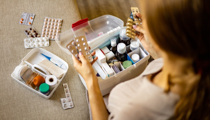 Storage organization in transparent plastic box drug, pill, syringe, bandage.