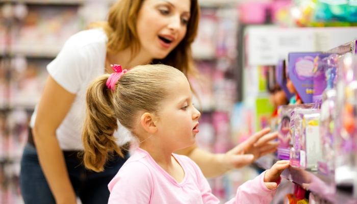 mother and daughter shopping for toys.