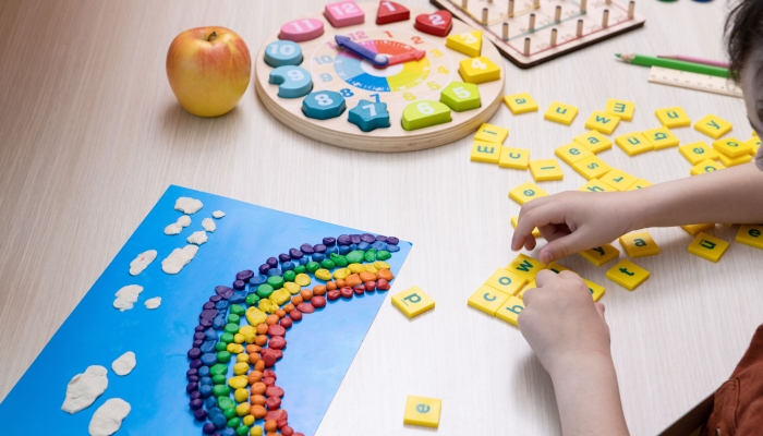 Child is studying, playing at home.