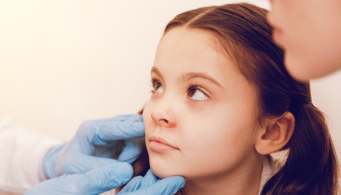 Attentive girl looking at her doctor.