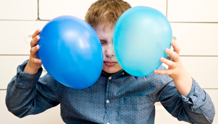 Boy with a blue balloon.