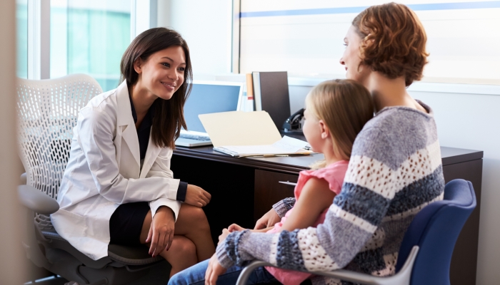 Pediatrician Meeting With Mother And Child In Hospital.