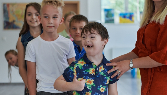 Preschool children wait in line for new and interesting games.