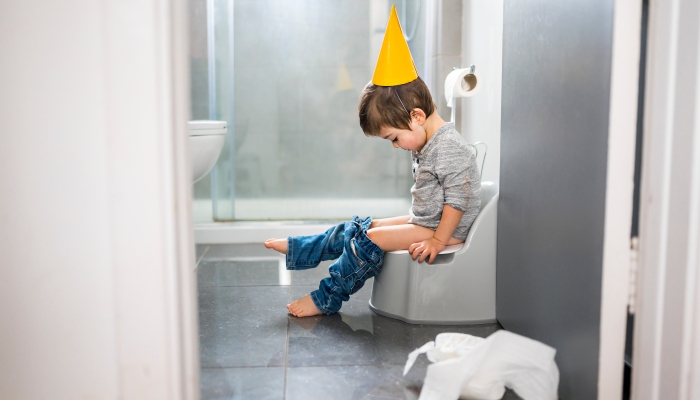 A two year old boy on chamber pot, successfull hygiene.