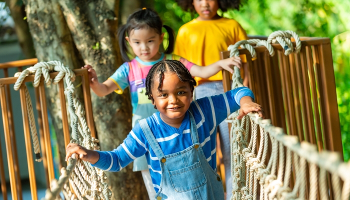 Children kid enjoy outdoor activity playing and learning at school playground.