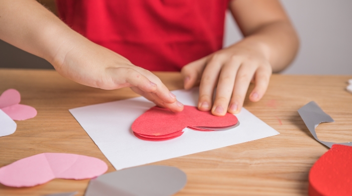 DIY holiday card with red paper heart.