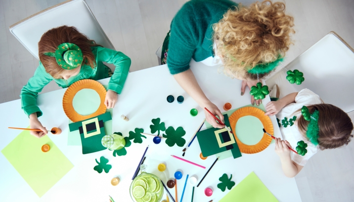 Family preparing decorations for Saint Patrick's Day.