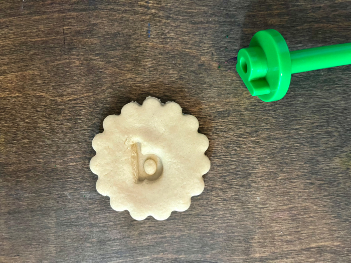 A tactile alphabet cookie with a b stamp.