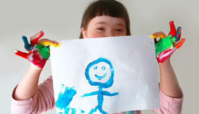 Cute girl with her painting.