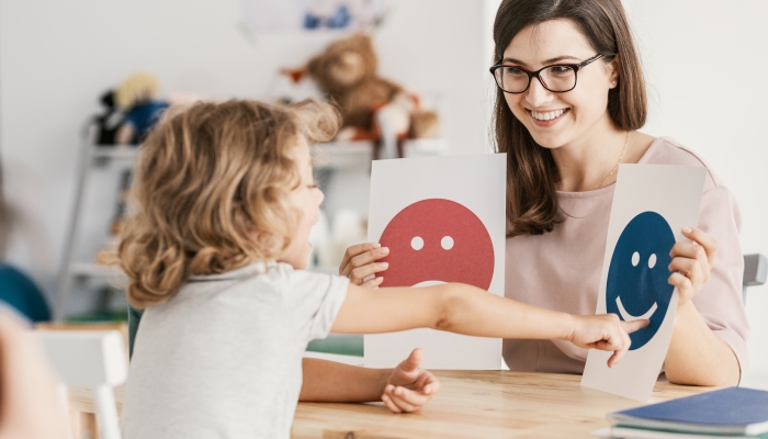 Emotion emoticons used by a psychologist during a therapy session with a child with an autism spectrum disorder.