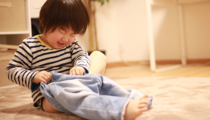 Image of a boy changing clothes.