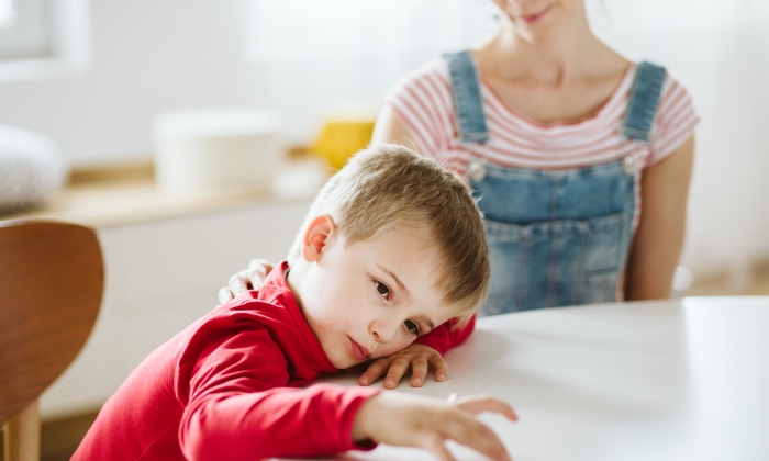 Kid with ADHD don't paying attention to his mother.