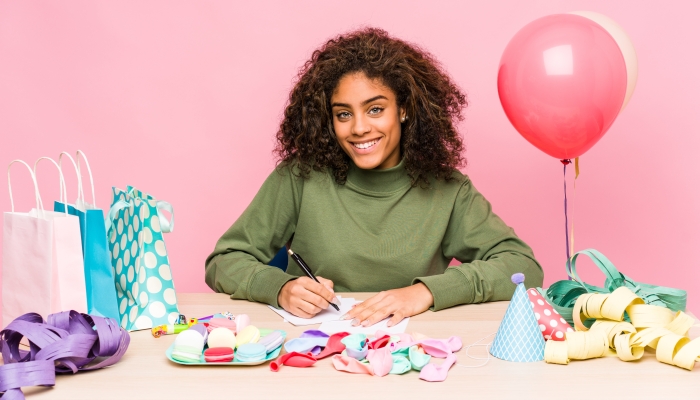 Young african american woman planning a birthday.