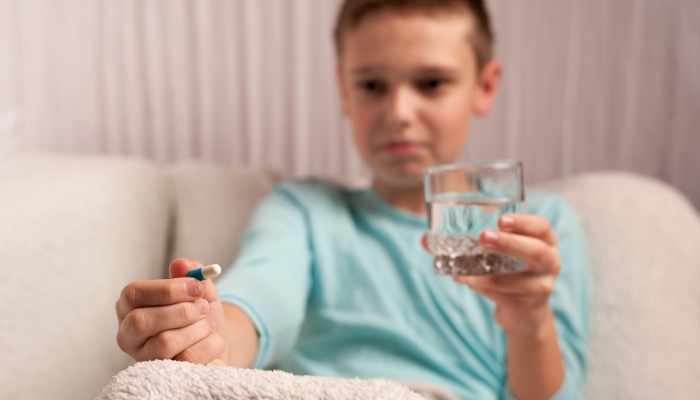 The process of taking medication by a teenager.