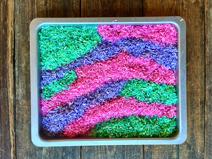 Place the rice in a pan for unicorn sensory rice.