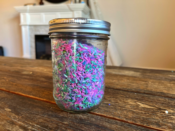 Make sensory bottles with unicorn sensory rice.