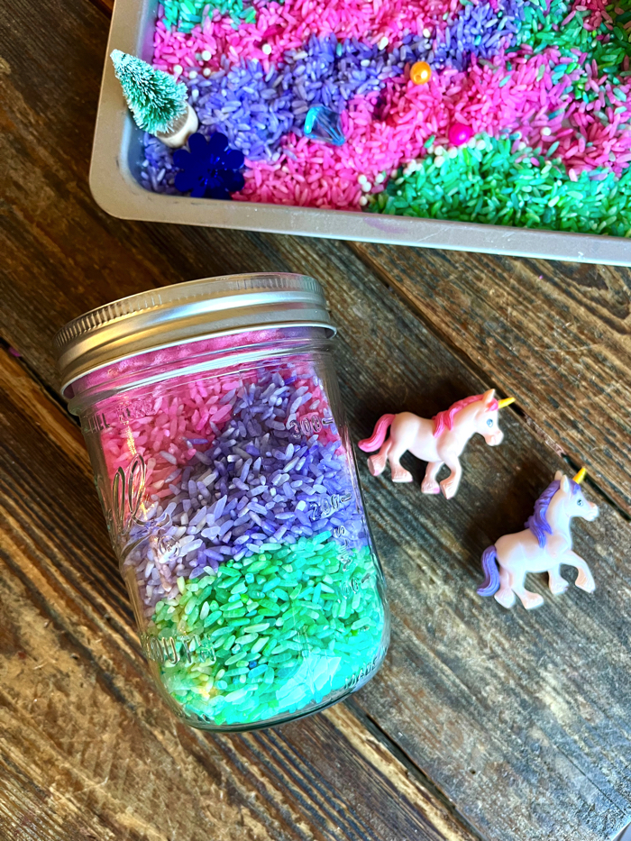 Playing with unicorn sensory rice.