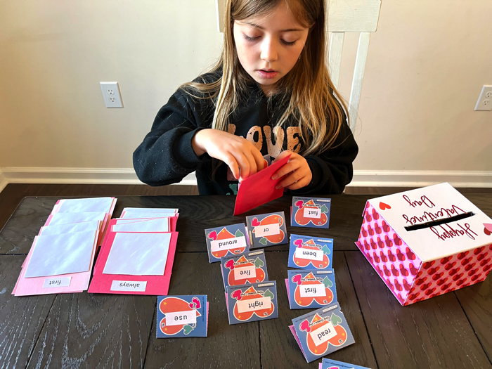 Playing with the Valentine's sight word game.