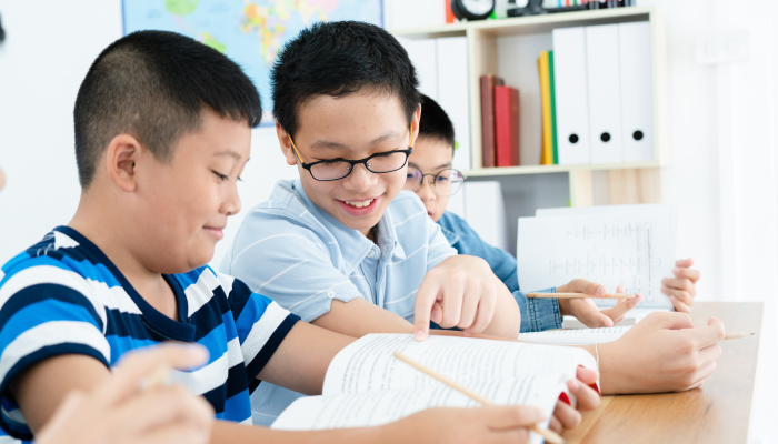 Group of asian students happy studying in classroom, everyone is committed to education.