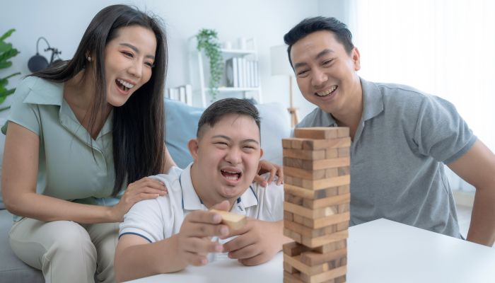 Happy Asian family doing activities together at home on vacation.