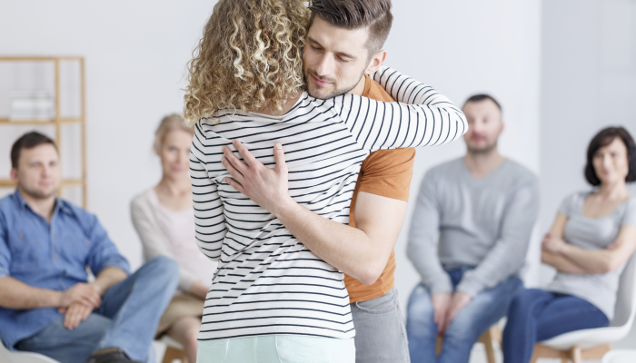 Hugging during support group meeting in rehab.