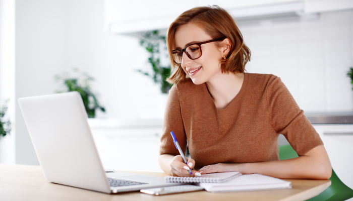 Woman on remote work or online education, using laptop computer.