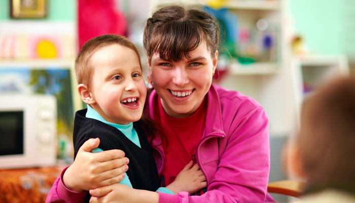 Cheerful kids with disabilities in rehabilitation center.