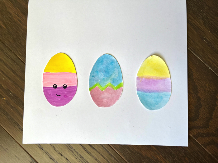 Draw a face on the Easter Egg Greeting Card Craft.