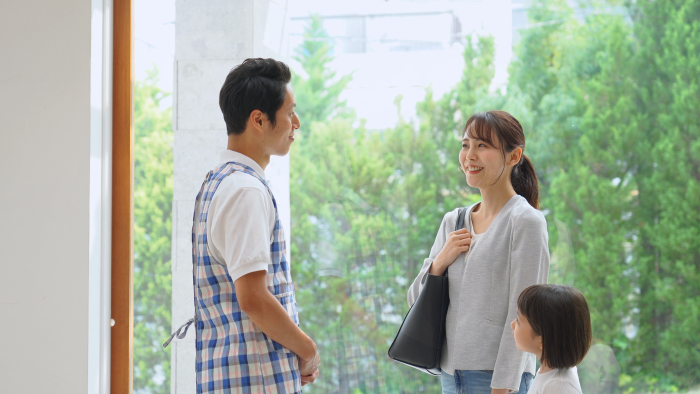 The nursery school teacher talking with the mother and daughter