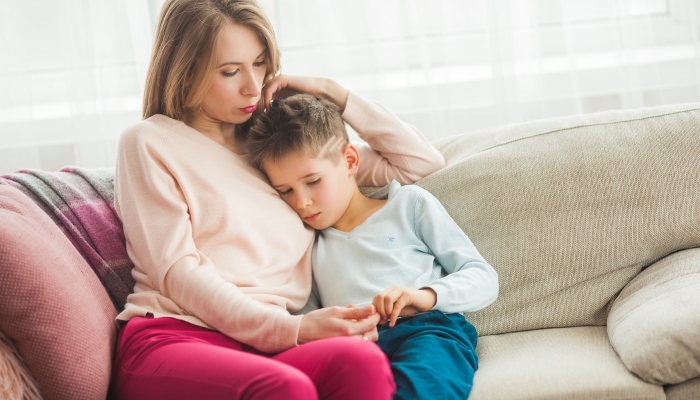 Mother trying to calm her little son.