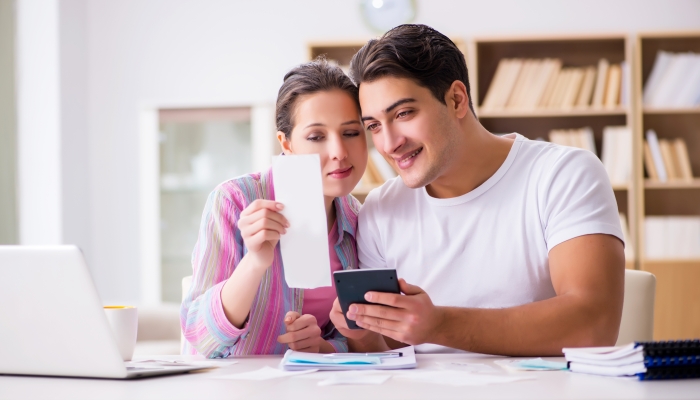 Young family discussing family finances.