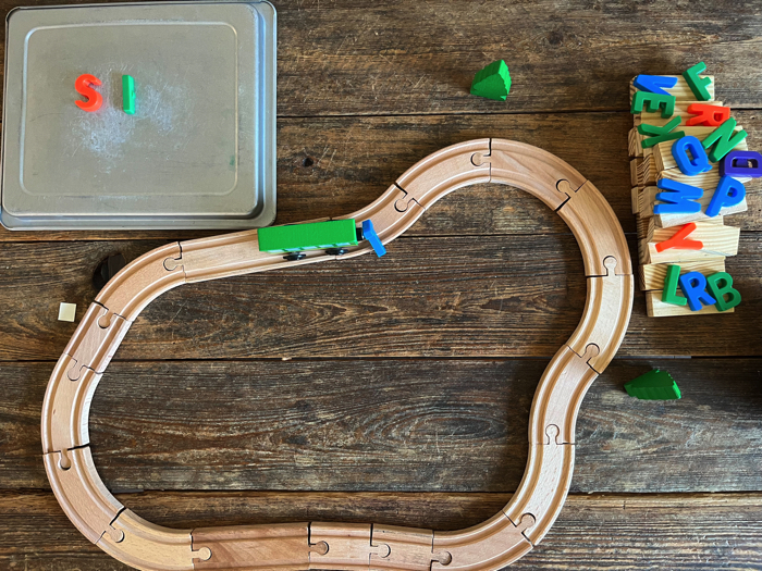 Alphabet Train Activity carrying a letter down the tracks.