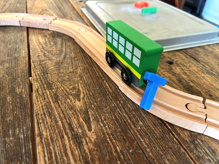 Alphabet Train Activity carrying a letter down the tracks.