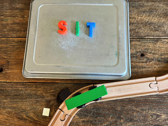 Alphabet Train Activity creating words on the cookie sheet.