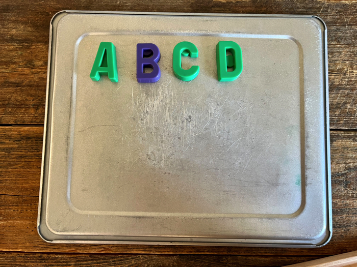 Alphabet Train Activity creating words on the cookie sheet.