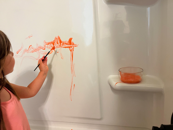 Using DIY Bath Paints in the tub.