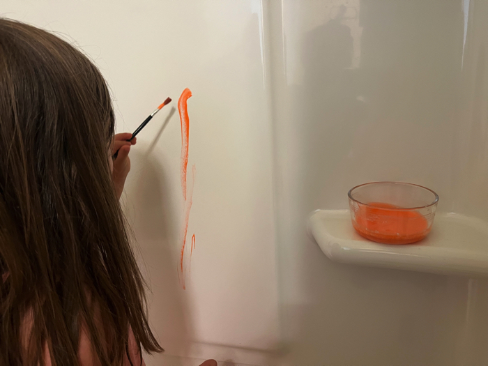 Using DIY Bath Paints in the tub.